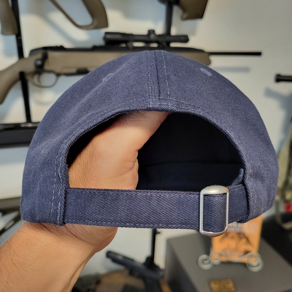 back of navy ballcap showing metal slide